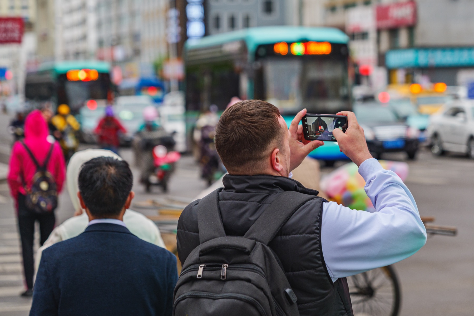 Traveler using a phone while preparing to pay in China
